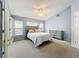 Main bedroom with dresser, double doors and carpet at 425 Tree Shore Dr, Orlando, FL 32825