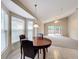 Breakfast nook with wood table and chairs, adjacent to living room at 425 Tree Shore Dr, Orlando, FL 32825