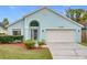 Charming light blue house with a two-car garage at 425 Tree Shore Dr, Orlando, FL 32825