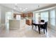 Bright kitchen with wood cabinets, island, and breakfast nook at 425 Tree Shore Dr, Orlando, FL 32825