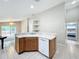 Kitchen island with sink and dishwasher, open to living area at 425 Tree Shore Dr, Orlando, FL 32825