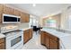 Open kitchen with breakfast nook and view to Gathering room at 425 Tree Shore Dr, Orlando, FL 32825