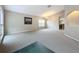 Spacious living room with neutral carpeting and a vaulted ceiling at 425 Tree Shore Dr, Orlando, FL 32825