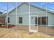 Home features a screened patio with a view of the backyard at 425 Tree Shore Dr, Orlando, FL 32825
