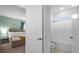 Bathroom with tub shower combo and adjacent bedroom at 4501 Monado Dr, Kissimmee, FL 34746