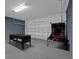 Garage with game area, including air hockey table at 4571 Cabello Loop, Kissimmee, FL 34746