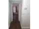 Hallway with dark wood floors and access to rooms at 5267 Images Cir # 307, Kissimmee, FL 34746