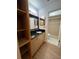 Bathroom with granite countertop, light wood cabinets, and tile floors at 547 Hunter Cir # 547, Kissimmee, FL 34758