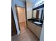 Clean bathroom with granite countertop, light wood cabinets, and tile floors at 547 Hunter Cir # 547, Kissimmee, FL 34758