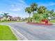 Landscaped entrance to the Coopersmith community with palm trees at 547 Hunter Cir # 547, Kissimmee, FL 34758