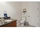 Guest bathroom with granite countertop, toilet and a door to another room at 550 Palermo Vista Ct, Longwood, FL 32750