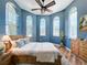 Bright bedroom with wood floors and rustic accents at 560 Lake Mills Rd, Chuluota, FL 32766