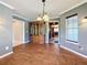 Elegant dining room with hardwood floors and built-in hutch at 560 Lake Mills Rd, Chuluota, FL 32766