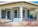 Front porch detail of the house, showing the front door at 560 Lake Mills Rd, Chuluota, FL 32766