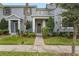 Front view of a two-story house with gray siding and landscaping at 7645 Fordson Ln, Windermere, FL 34786