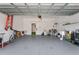 Garage with storage shelving, workbench, and bicycle at 7645 Fordson Ln, Windermere, FL 34786