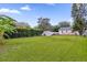 Large backyard with grassy lawn and storage shed at 830 Overspin Dr, Winter Park, FL 32789