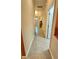 Bright hallway with tile flooring and access to bedrooms and bathrooms at 9217 Shadow Pinar Ct, Orlando, FL 32825