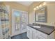 Bathroom with shower/tub, double vanity and French doors at 9664 Weatherstone Ct, Windermere, FL 34786