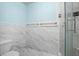 Clean bathroom with marble tile and a toilet at 10637 Deergrass Ln, Orlando, FL 32821