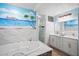 Bathroom with a double vanity, walk-in shower, and a jetted tub at 10637 Deergrass Ln, Orlando, FL 32821