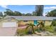 Ranch-style home with tile roof, attached garage, and landscaped yard at 10637 Deergrass Ln, Orlando, FL 32821
