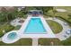 Community pool and spa with ample seating and a covered patio at 10637 Deergrass Ln, Orlando, FL 32821