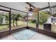 Screened porch overlooking backyard with ceiling fan at 10637 Deergrass Ln, Orlando, FL 32821