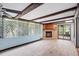 Sunroom with wood beams, tile floors, and a fireplace at 10637 Deergrass Ln, Orlando, FL 32821