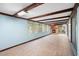 Sunroom with wood beams, tile floors, and a fireplace at 10637 Deergrass Ln, Orlando, FL 32821