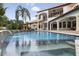 Resort-style pool with spa and waterfall feature at 1140 Kelso Blvd, Windermere, FL 34786