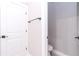 Small bathroom with a toilet and a white door at 12386 Sw 89Th St, Dunnellon, FL 34432