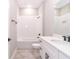 Clean bathroom with white subway tile, a white vanity, and a bathtub at 12662 Sw 62Nd Pl, Ocala, FL 34481