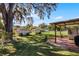 Large backyard with covered patio, sheds, and plenty of grass at 15 Volusia Dr, Debary, FL 32713