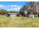 Spacious backyard with large tree and shed at 15 Volusia Dr, Debary, FL 32713