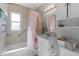 Clean bathroom with a tub, shower, and updated vanity at 15 Volusia Dr, Debary, FL 32713