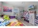 bedroom with full-size bed, and lots of toys and storage at 15 Volusia Dr, Debary, FL 32713