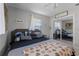 Cozy bedroom with a king-size bed and mirrored closet doors at 15 Volusia Dr, Debary, FL 32713