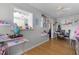 Bright dining area with wood floors, kitchen pass-through, and built-in shelving at 15 Volusia Dr, Debary, FL 32713