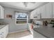 Efficient kitchen with white cabinets, and modern appliances at 15 Volusia Dr, Debary, FL 32713
