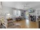 Living room with hardwood floors and access to the front porch at 15 Volusia Dr, Debary, FL 32713