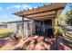 Brick patio with pergola and grilling area at 15 Volusia Dr, Debary, FL 32713