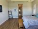 Main bedroom with hardwood floors and ensuite bathroom at 15511 Shorebird Ln, Winter Garden, FL 34787