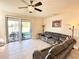 Bright living room with sliding glass doors leading to the backyard at 15531 Waterleigh Cove Dr, Winter Garden, FL 34787