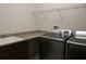 Laundry room with washer, dryer, and utility sink at 15721 Shorebird Ln, Winter Garden, FL 34787