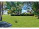Large grassy backyard with mature trees and ample space at 20 Maynard Ave, Orlando, FL 32803