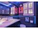 Clean bathroom with dark vanity, modern toilet, and LED lighting at 20 Maynard Ave, Orlando, FL 32803