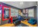 Stylish salon space featuring red accents, mirrors, and comfortable styling chairs at 20 Maynard Ave, Orlando, FL 32803