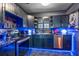 Modern dark kitchen with stainless steel appliances and blue LED lighting at 20 Maynard Ave, Orlando, FL 32803