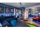 Living room with dark walls, unique decor, and open concept kitchen at 20 Maynard Ave, Orlando, FL 32803